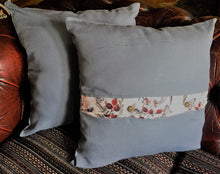 Load image into Gallery viewer, Denim blue linen cushions with a vibrant berry trim and berry print cushions with a contrasting blue linen button trim. 