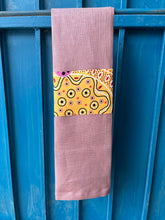 Load image into Gallery viewer, A rose pink tea towel made from European linen and featuring the art work Summertime Rainforest by Indigenous artist Heather Kennedy.