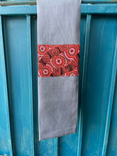 Load image into Gallery viewer, A blue tea towel made from European linen and featuring the art work Salt Lake by Australian Indigenous artist Heather Kennedy. The tea towel is hanging on a deep blue coloured wall.