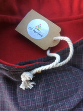 Load image into Gallery viewer, wool blend dog coat; grey check outer with red wool flannel lining, available in 5 sizes to suit all dogs. Flay lay photo showing close up of both fabrics used and the swing tag
