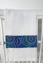 Load image into Gallery viewer, Linen tea towel, indigenous design tea towel, Australian Aboriginal artist, Womens Body Dreamimg by Cindy Wallace. A brilliant splash of blues, greens and teals on white linen