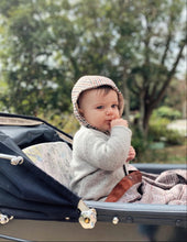 Load image into Gallery viewer, classic vintage style baby bonnet in merino cashmere blend with linen lining. Baby in vintage pram wearing bonnet.