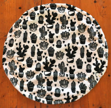 Load image into Gallery viewer, a round cat mat made with 3 layers of minky. Featuring various black and white cactuses in pots on a white background, A monochrome design