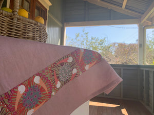 Linen tea towel, indigenous design tea towel, Australian Aboriginal artist, Plum and Bush Banana by Laurel Tanlels on dusty pink linen