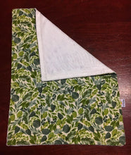 Load image into Gallery viewer, Dolls minky blanket cotton front synthetic minky back green leafy foliage print close up of full blanket showing folded minky corner