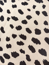 Load image into Gallery viewer, Beautiful soft and drapey rayon bandanna scarves in a timeless paisley designs, featuring a multitude of colours including mustard, teal and cobalt blue. A very spring fashion accessory for both humans and fur babies. animal print, leopard design. Colours are in light orange beige with black animal print spot.