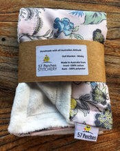 Load image into Gallery viewer, Tropical garden print minky blanket cotton front synthetic lining folded showing labels and packaging