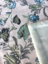 Load image into Gallery viewer, Tropical garden print minky blanket cotton front synthetic lining closeup shows printed cotton and folded corner to reveal minky lining