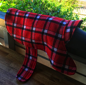 Morty is wearing his 90% wool dog coat. keeping warm and cosy in the cold winter temperatures. Featuring blanket style wool in red check and lined with 100% cotton.